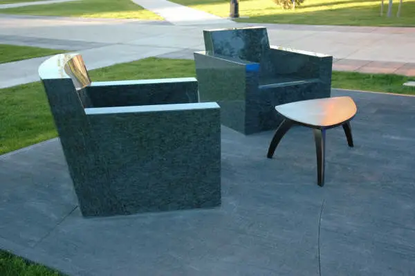 Cast concrete outdoor chairs and side table