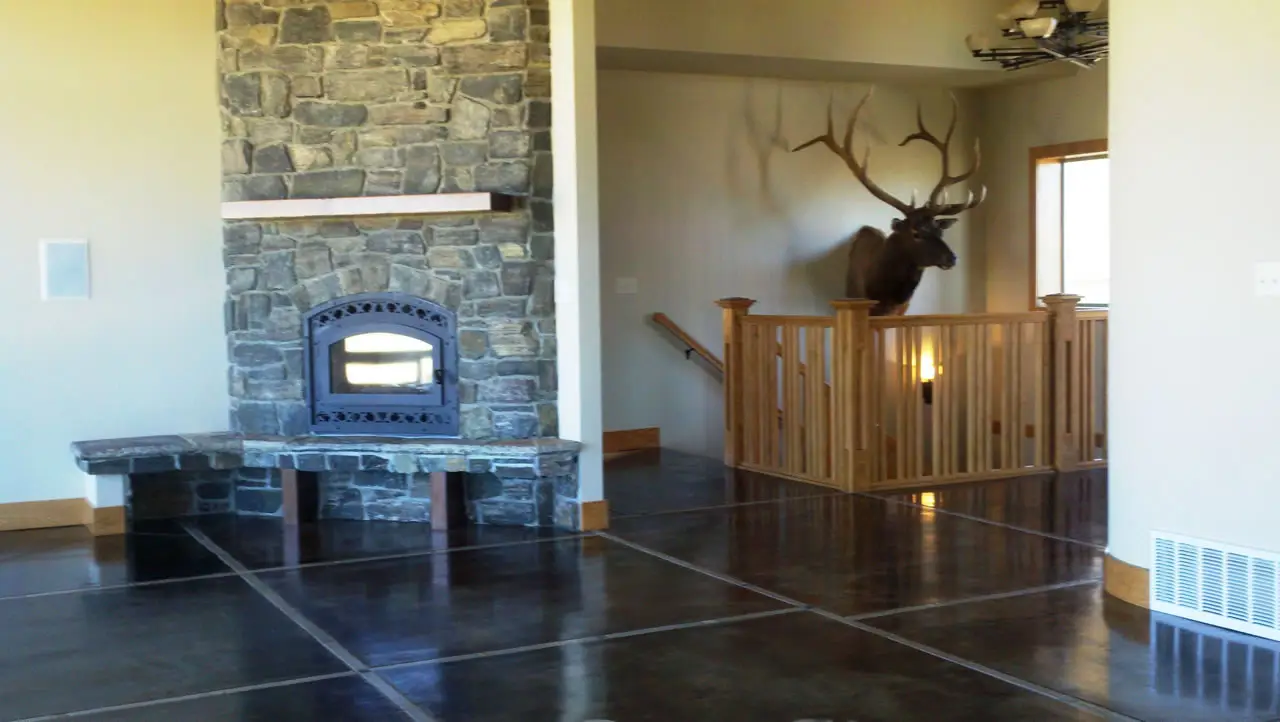 Polished floor in a stone fireplace room