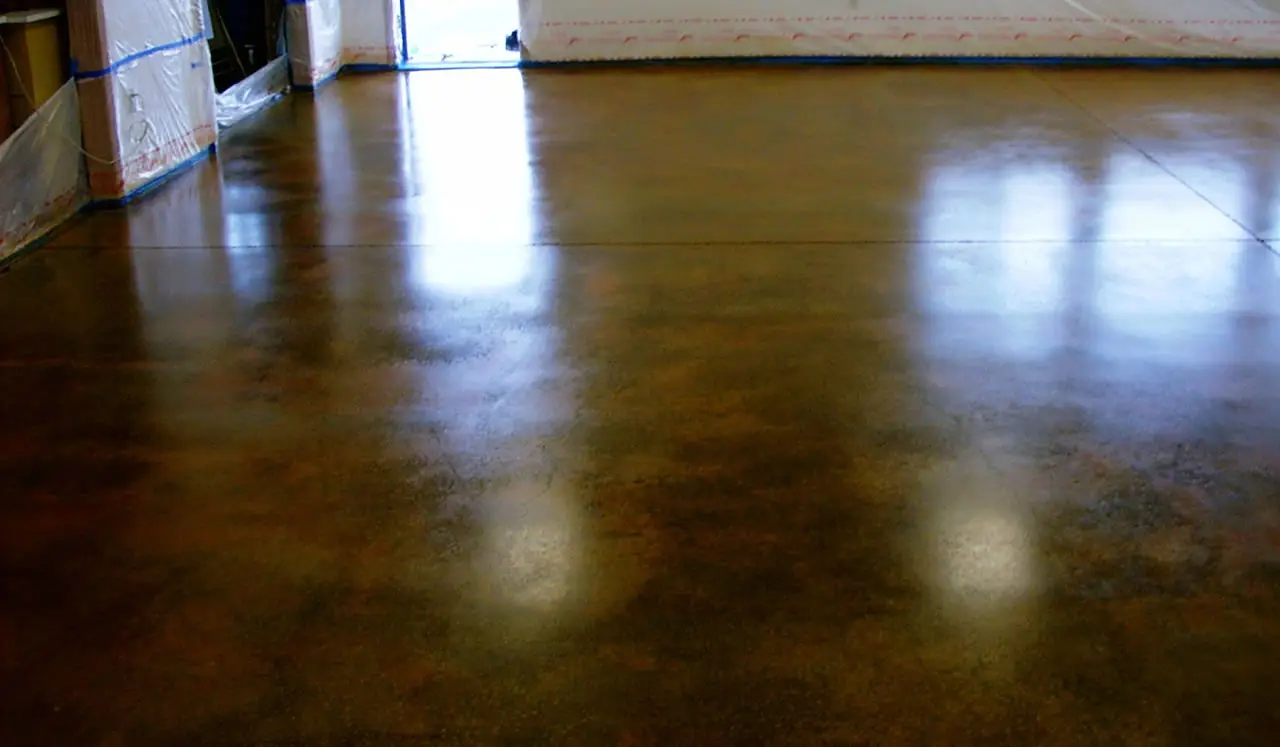 Stained and sealed interior floor with a high-gloss finish