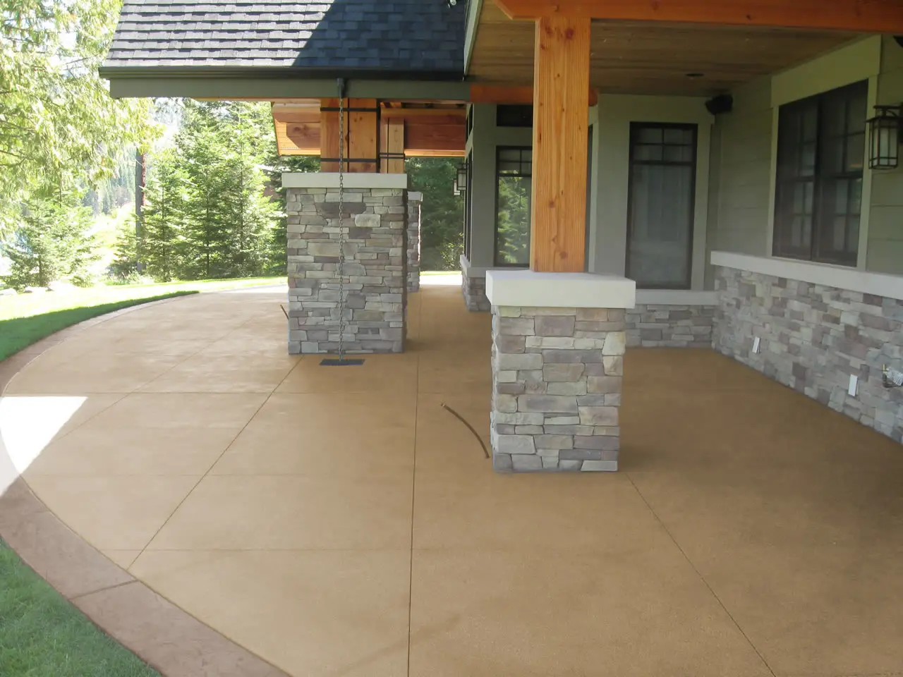 Colored broom-finish patio under a covered porch