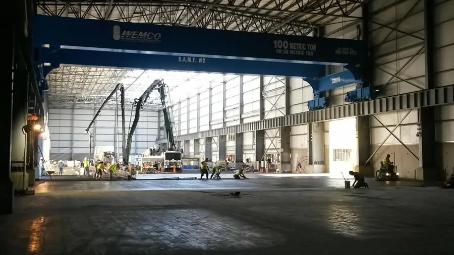 Industrial warehouse floor pour under a bridge crane